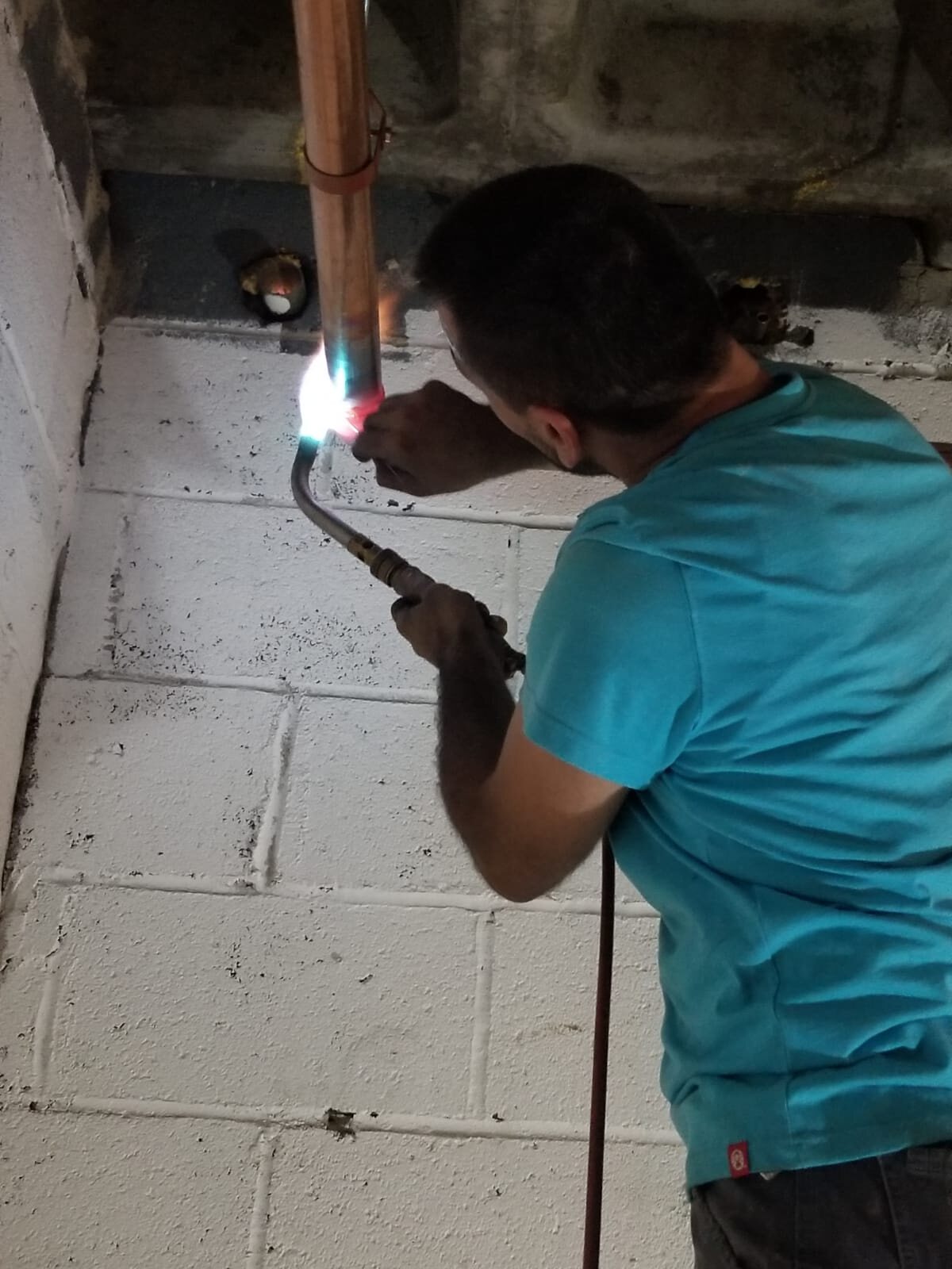 Technician working on a copper piping installation